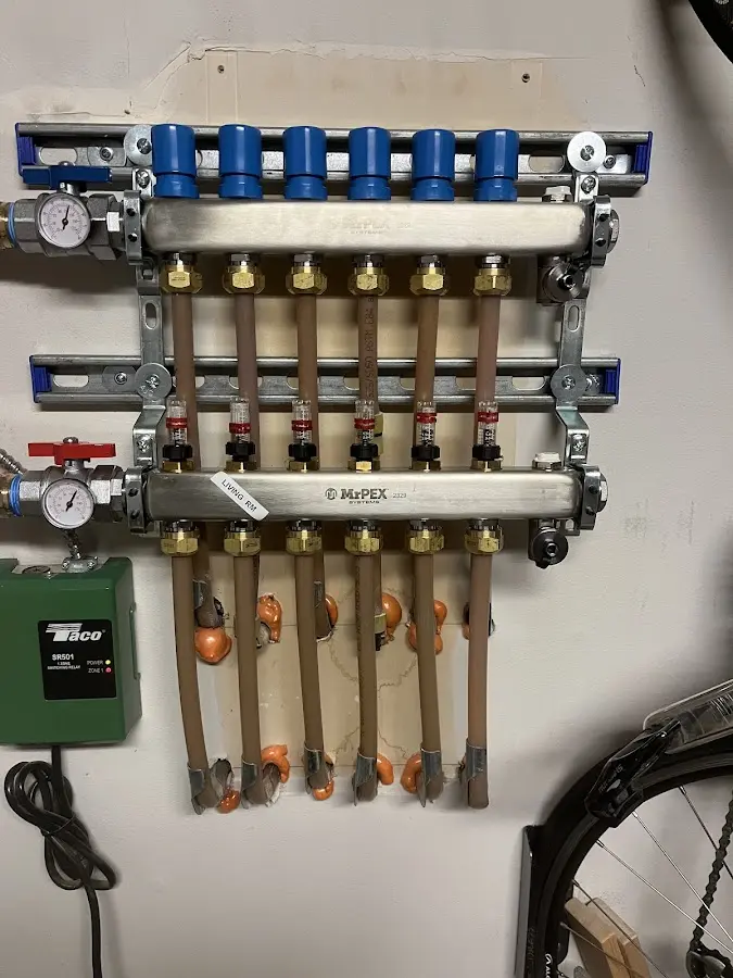 Plumber performing Water Heater Repair at a residential property in Brier